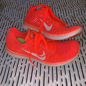 Neon Orange Nike Flyknit shoes + 3 Nike headbands